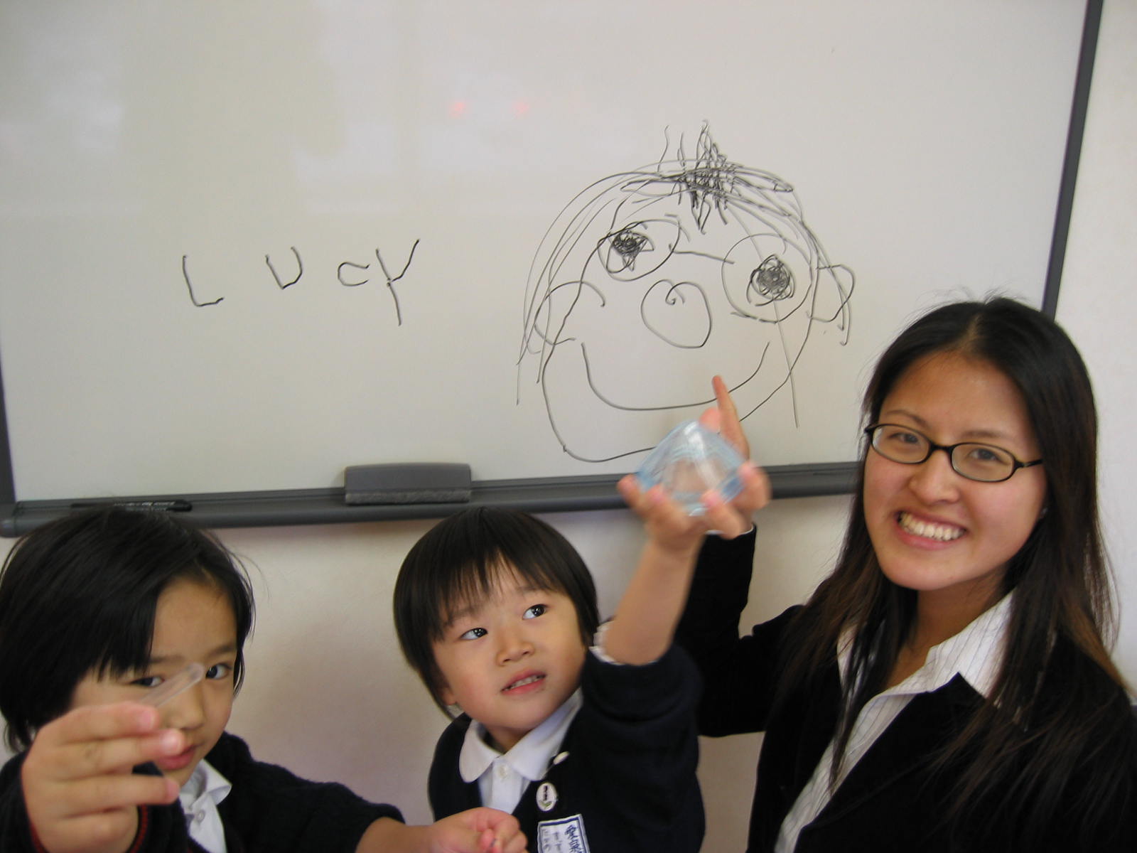 Lucy Lin teaching students in Japan